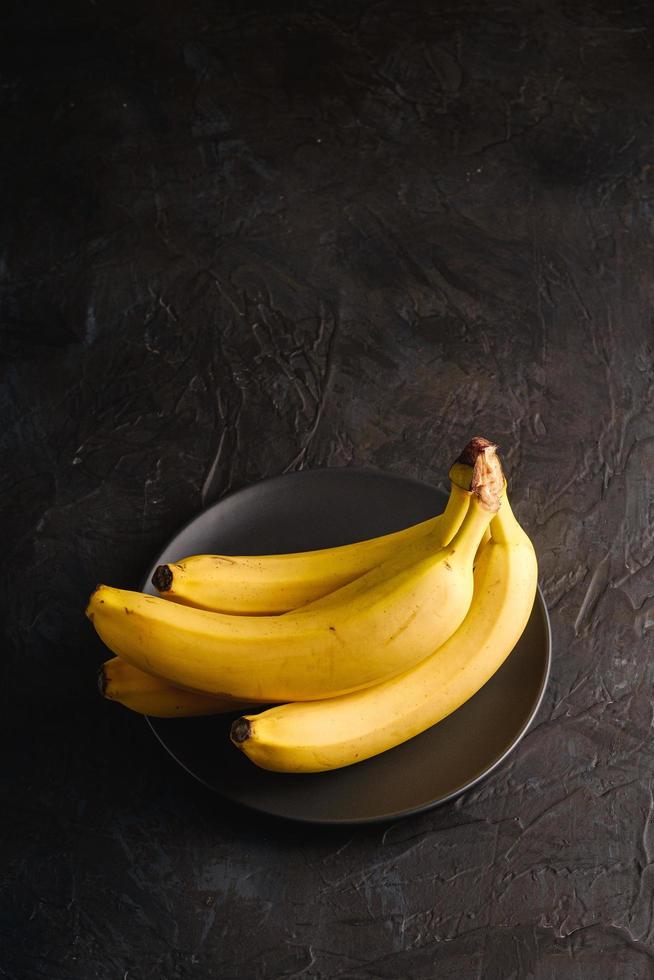 Bananas dark textured background photo