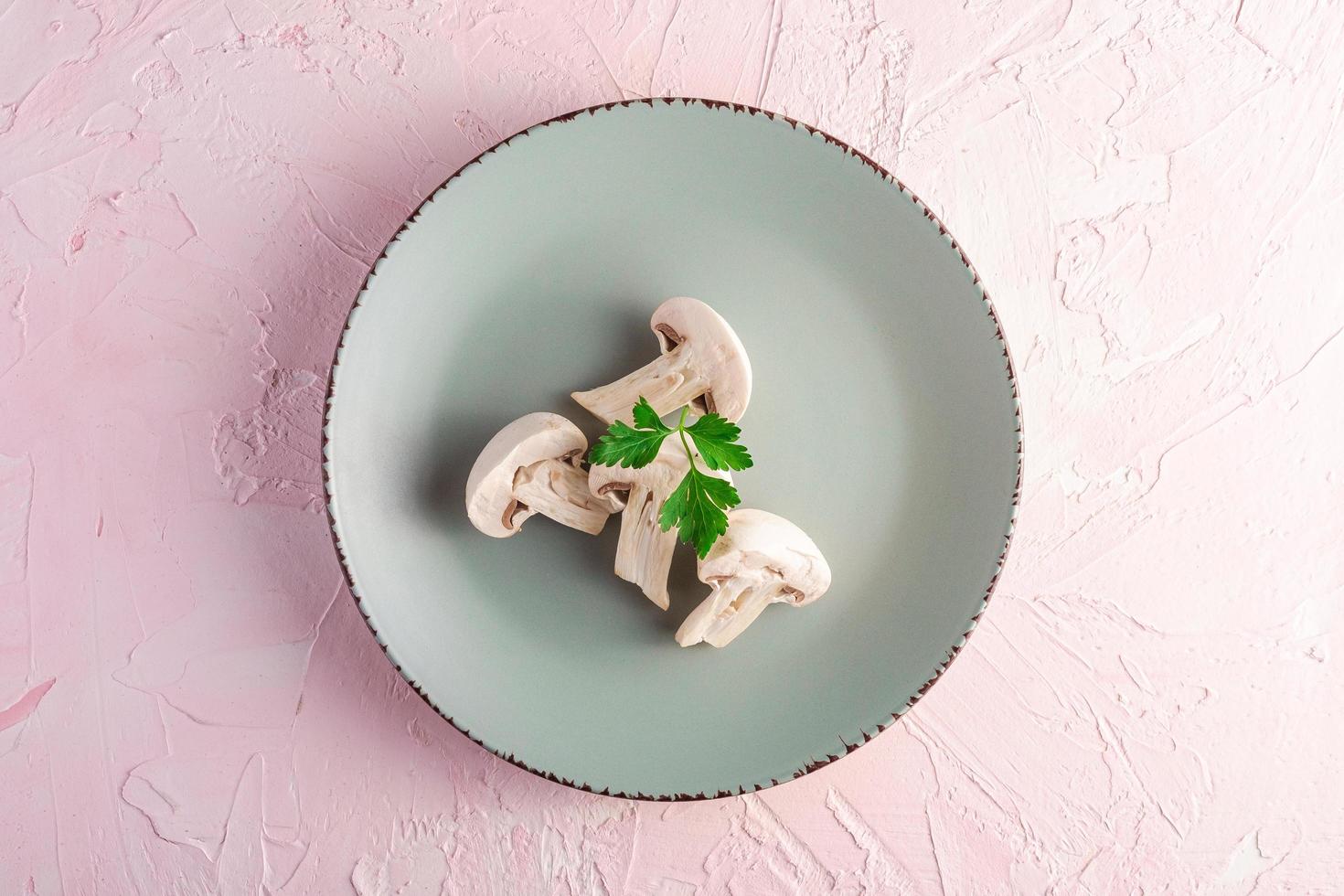 Four mushrooms on grey plate  photo