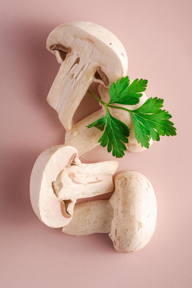 Mushrooms on pink plate with parsley greenery photo