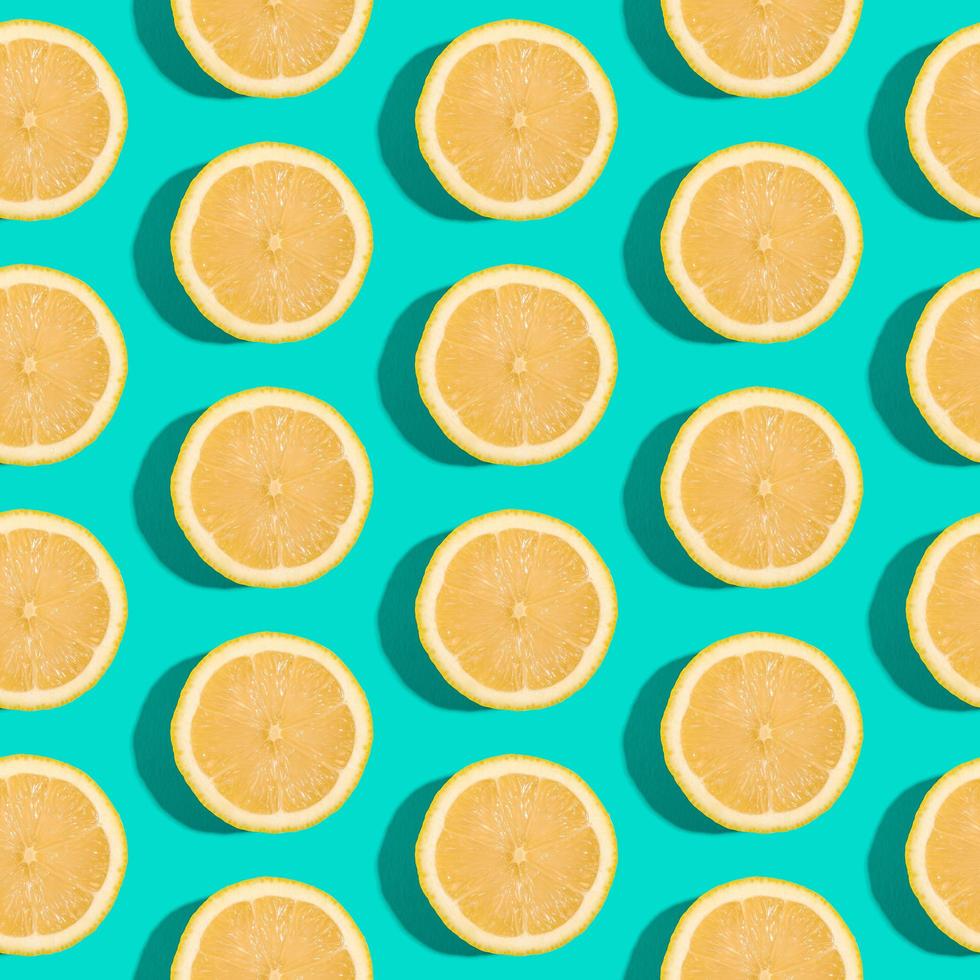 Lemon citrus fruits seamless pattern on green turquoise minimal background photo