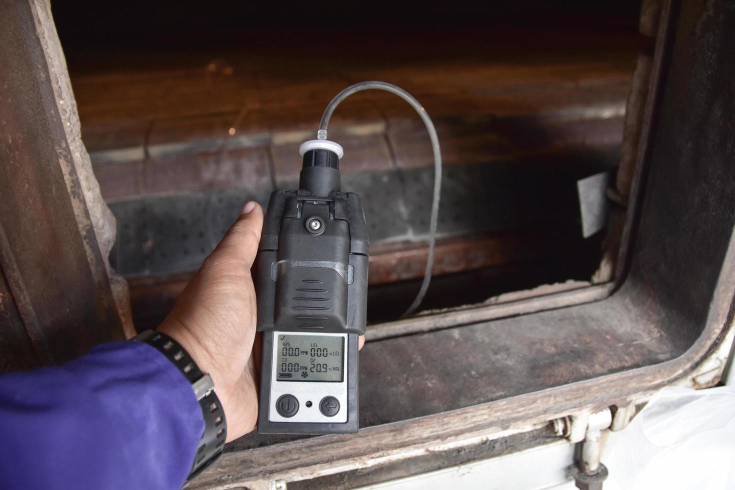 Hand using a gas detector  photo