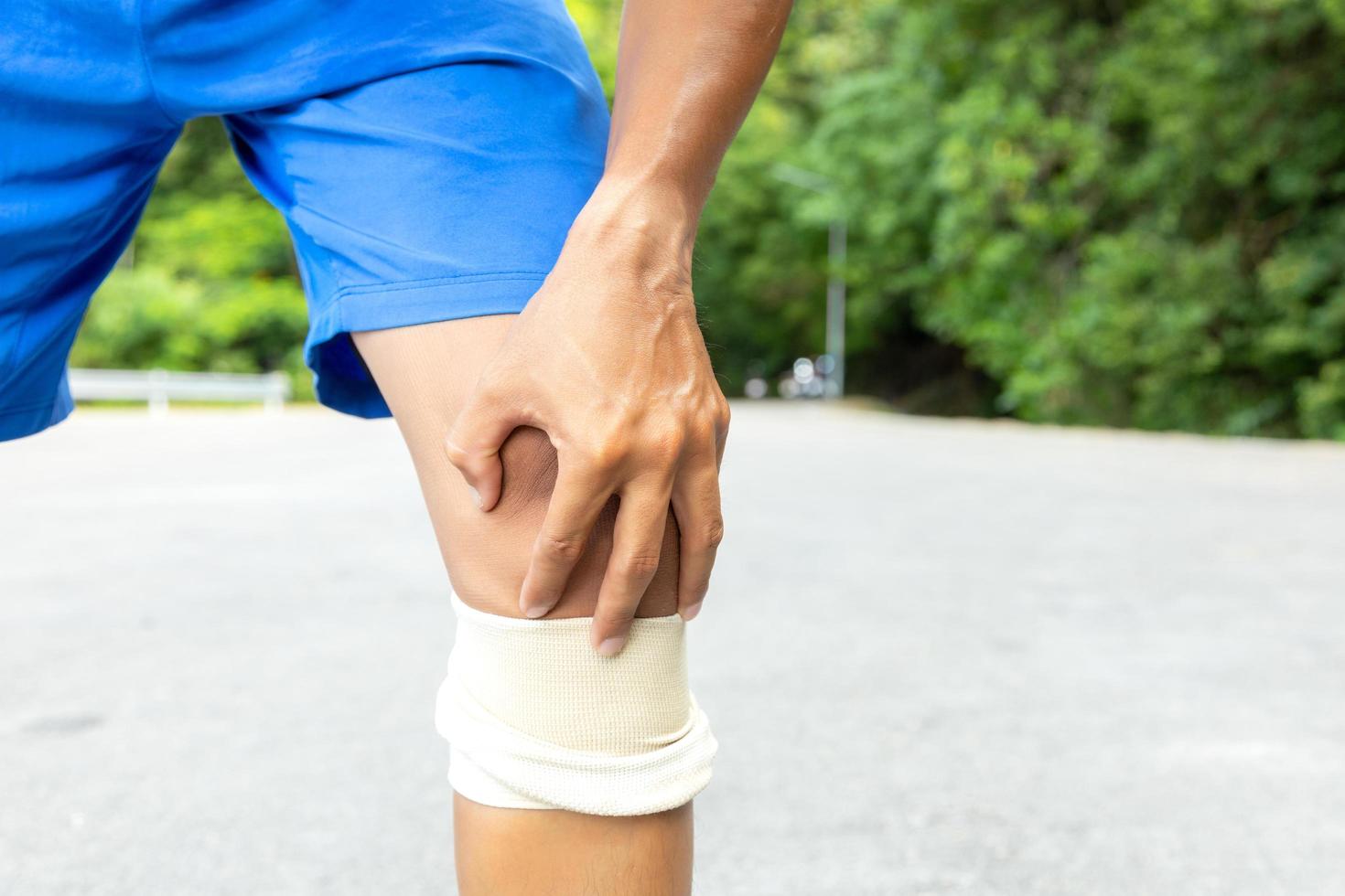 Man with blue running shorts takes a rest break  photo