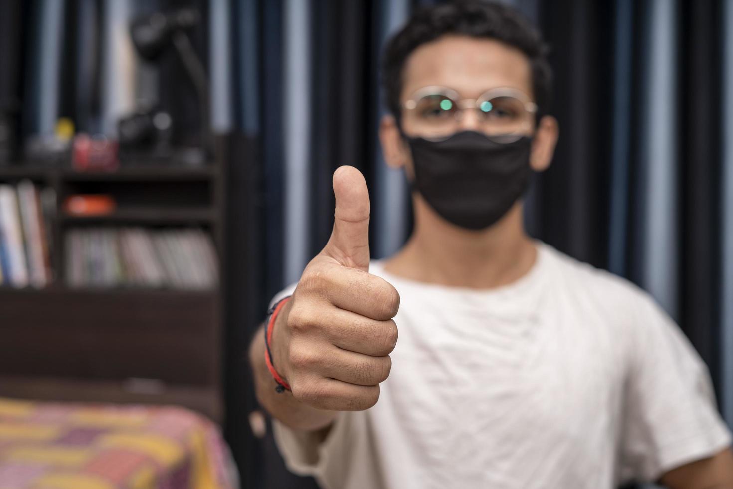 Young Indian boy showing thumbs up photo