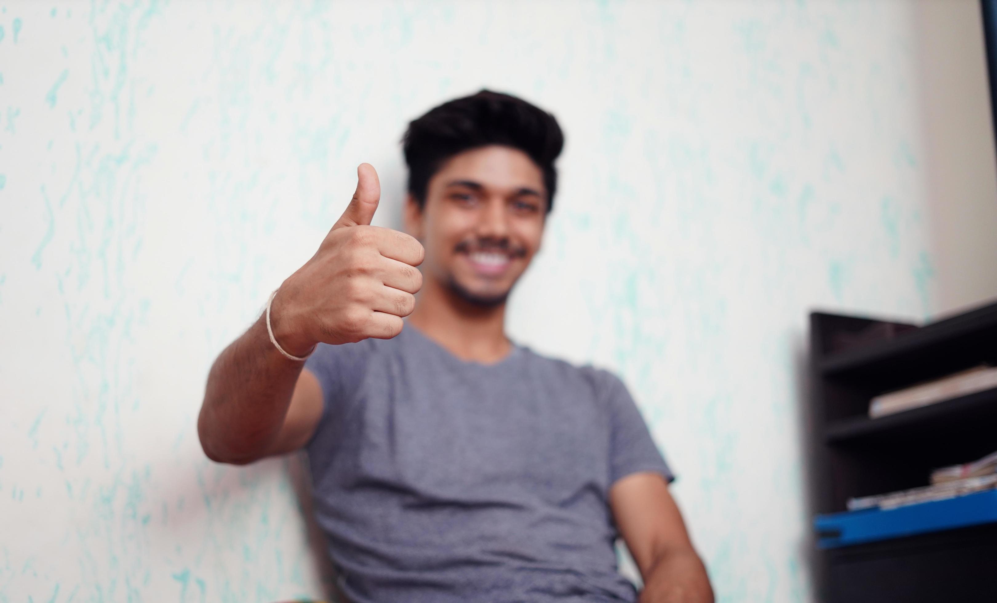 Young Asian boy showing thumbs up 1223997 Stock Photo at Vecteezy