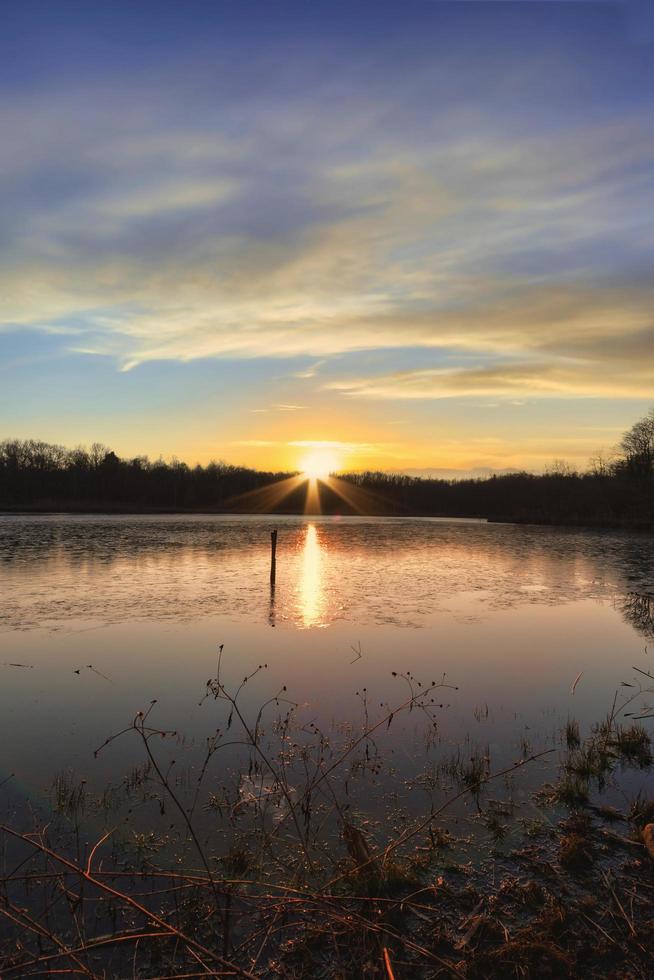 Sunset on lake in autumn  photo