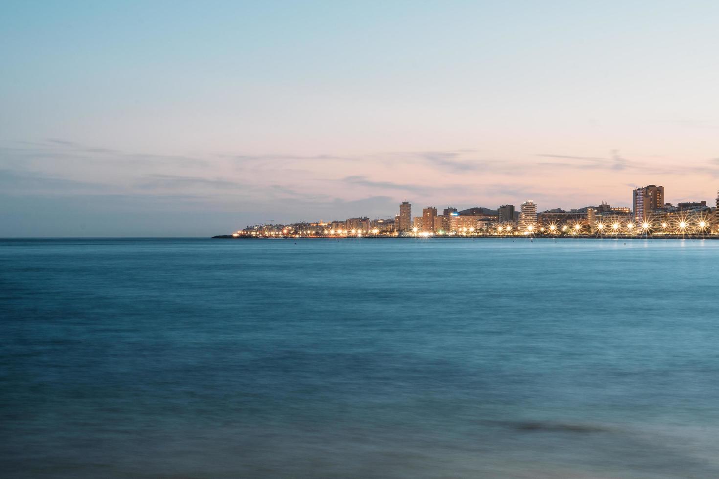 Illuminated coastal town  photo