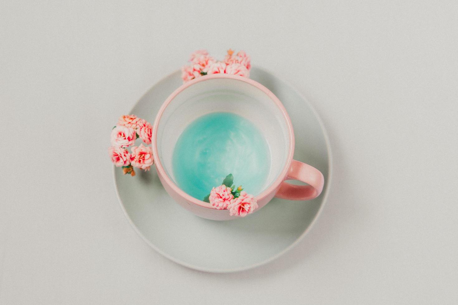 Cup and saucer on neutral background photo
