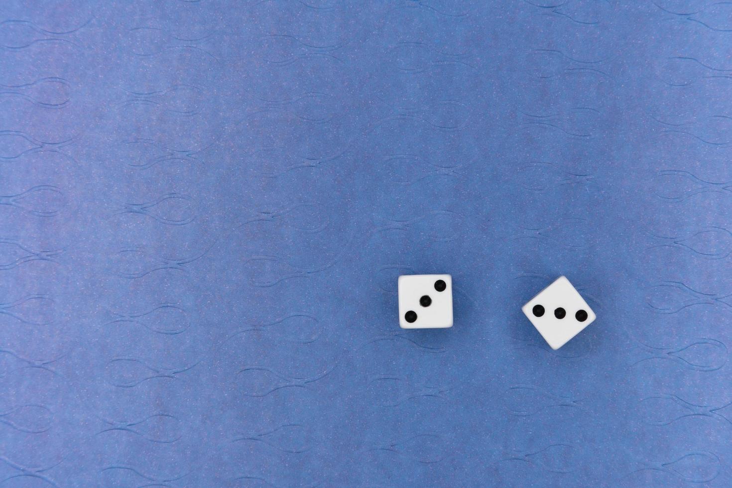 Pair of dice on blue background photo