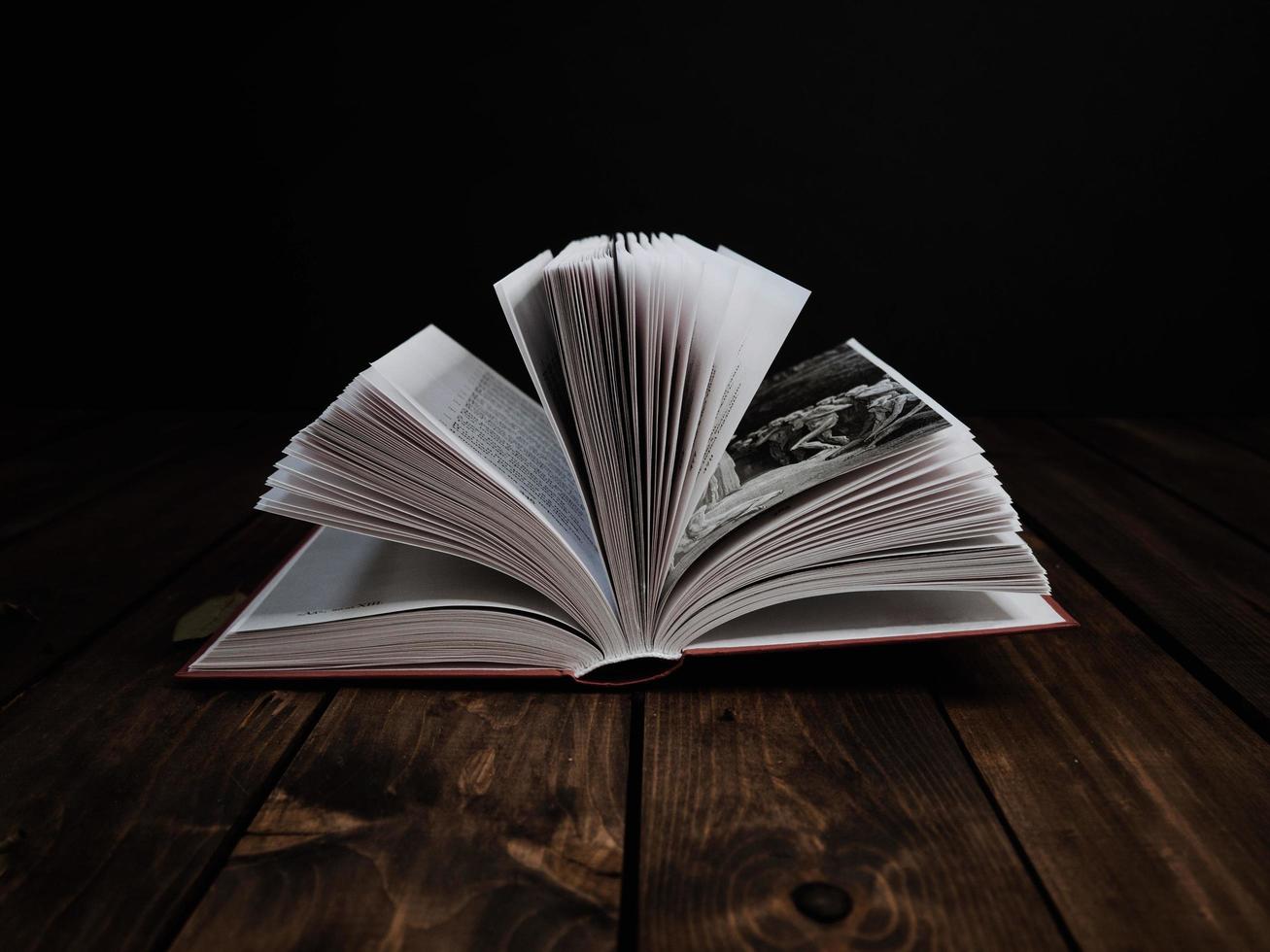 Open book on dark background photo