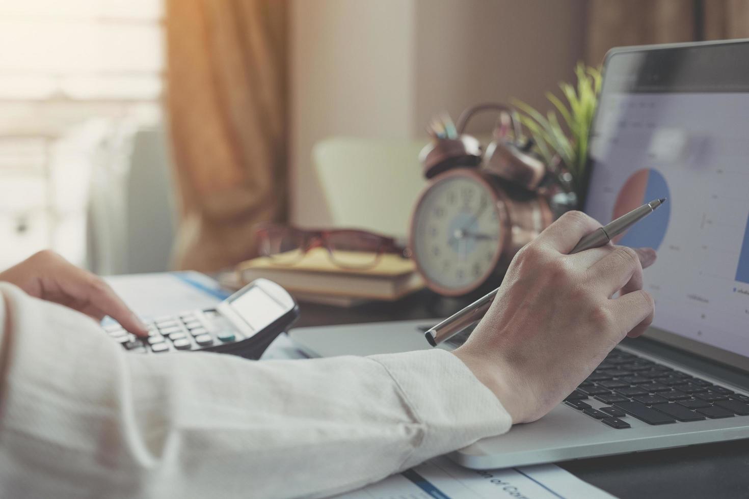 A business professional working on laptop in home office photo