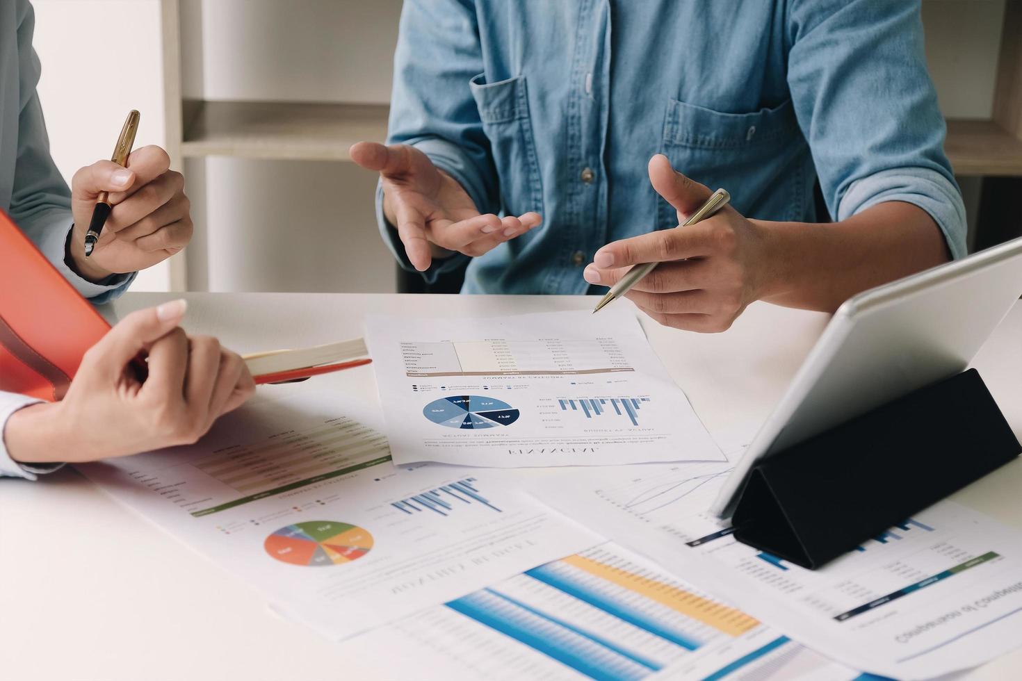 Two coworkers discussing financial plan for company photo