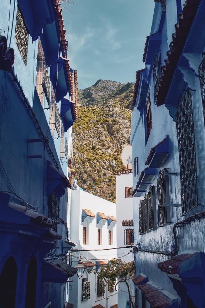 Houses and mountains seen through alley photo