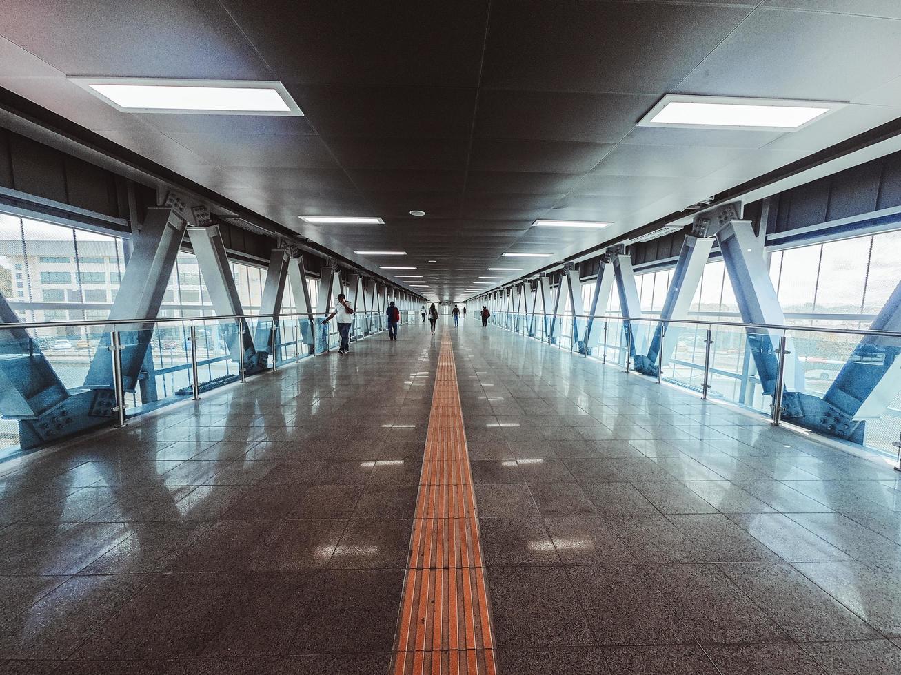 People walking inside tunnel photo