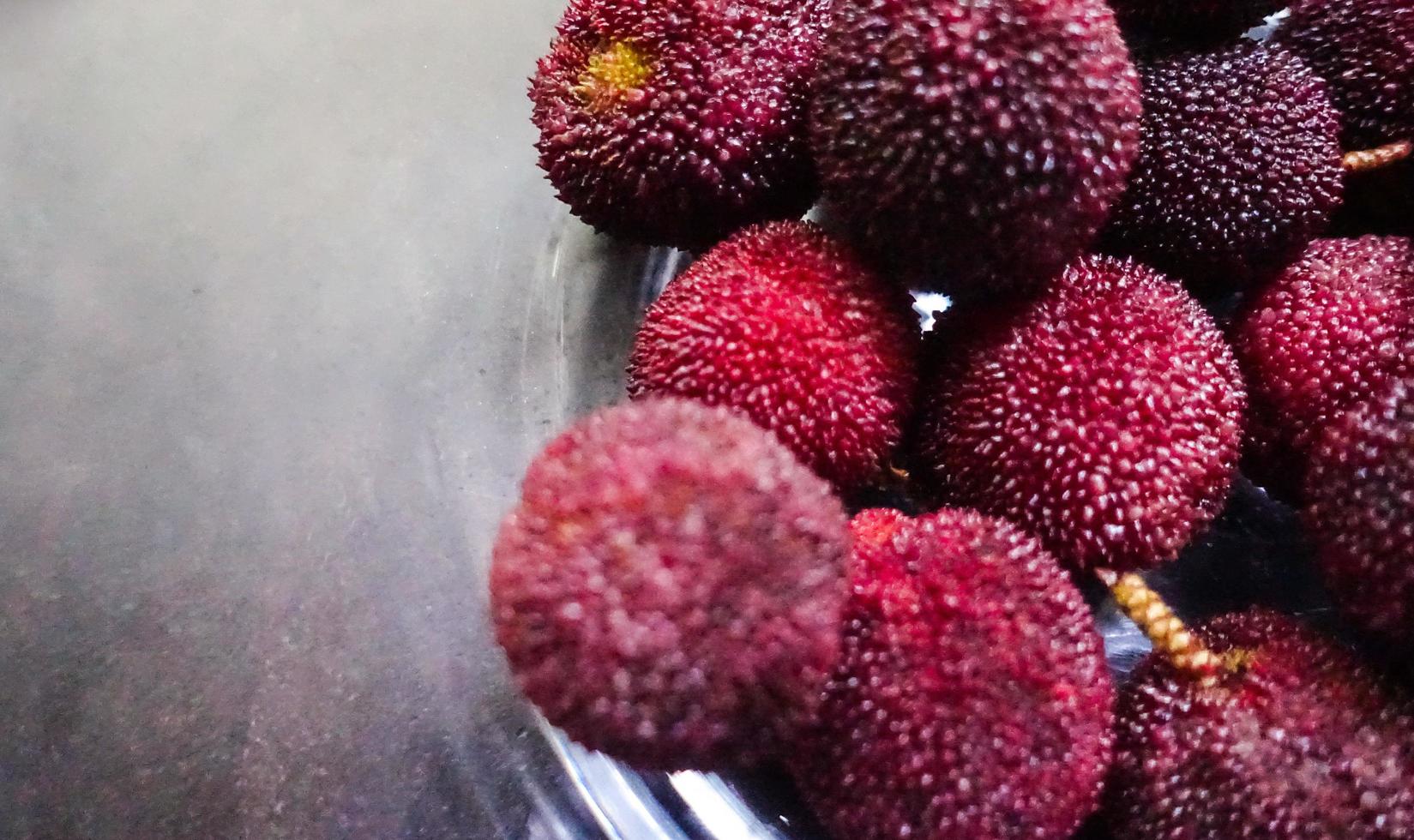 Close-up of group of Chinese bayberries photo