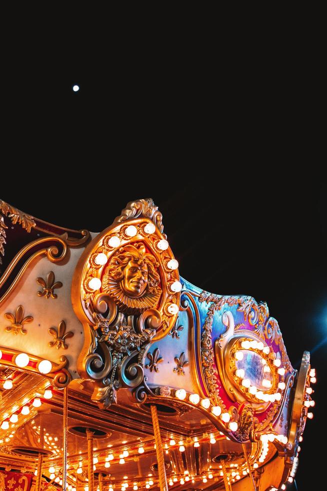 Carousel lights at night photo