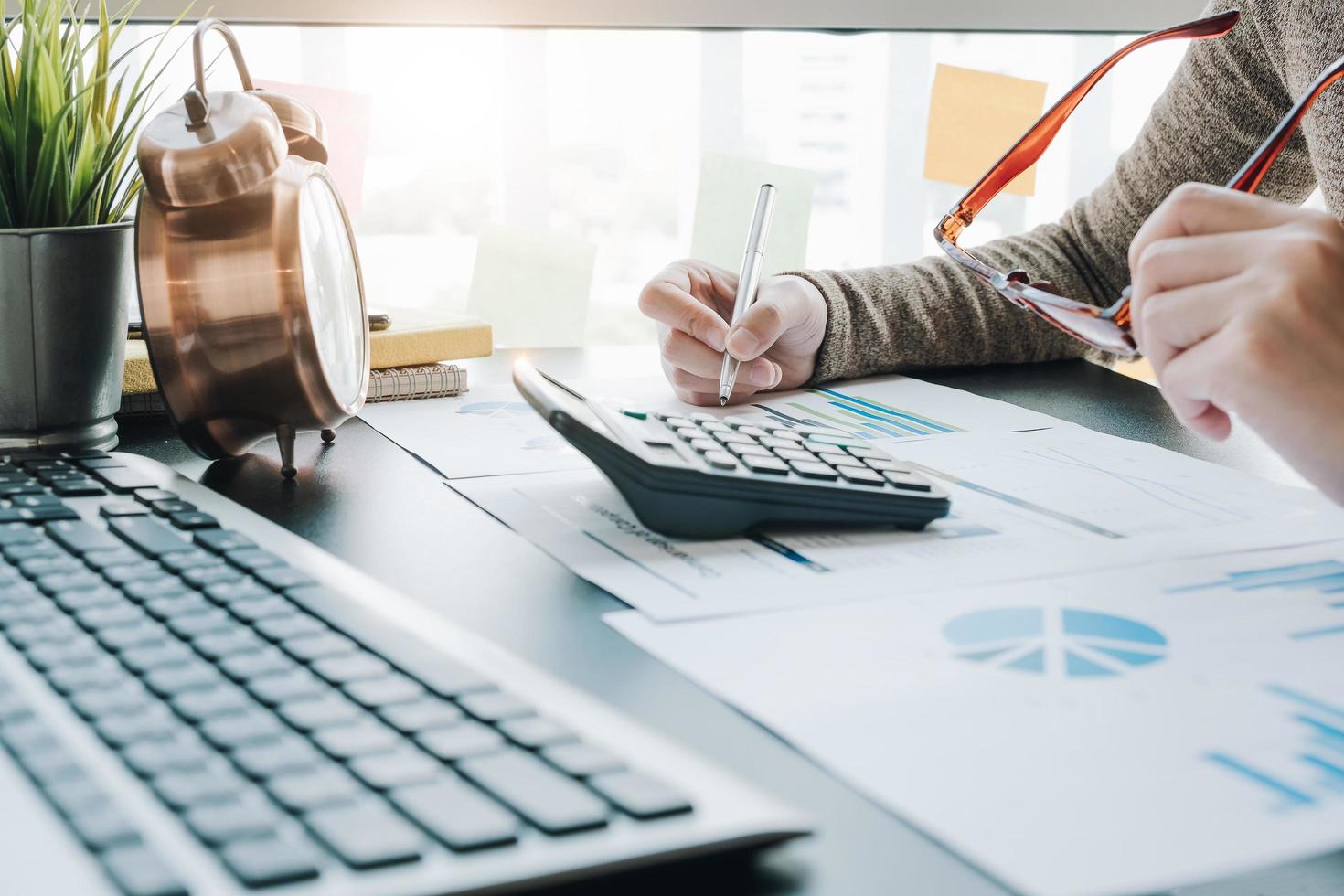 Close-up of businesswoman working on report photo