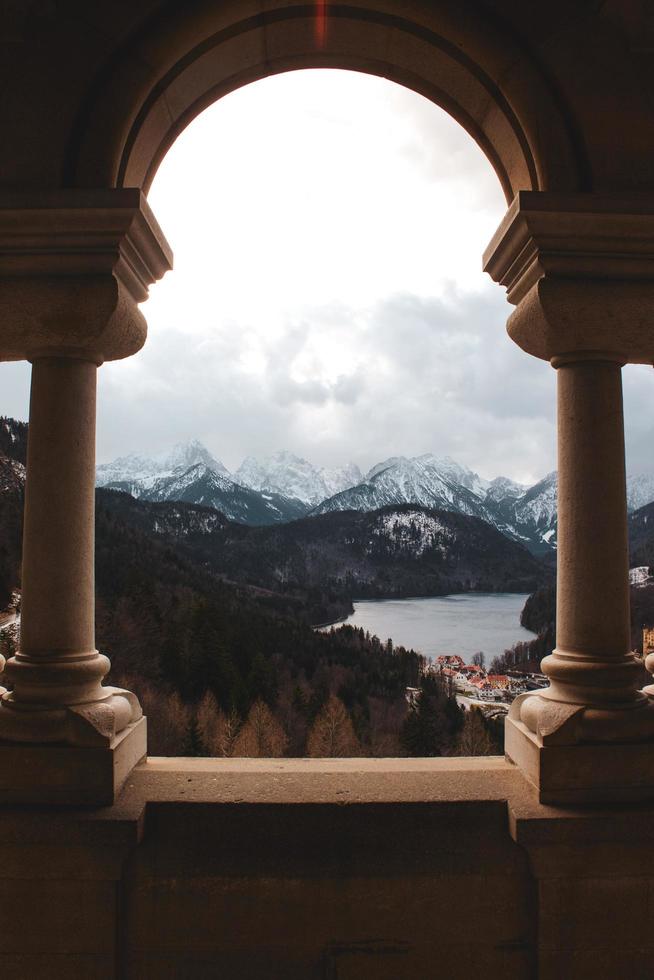 Mountain Range seen between columns photo