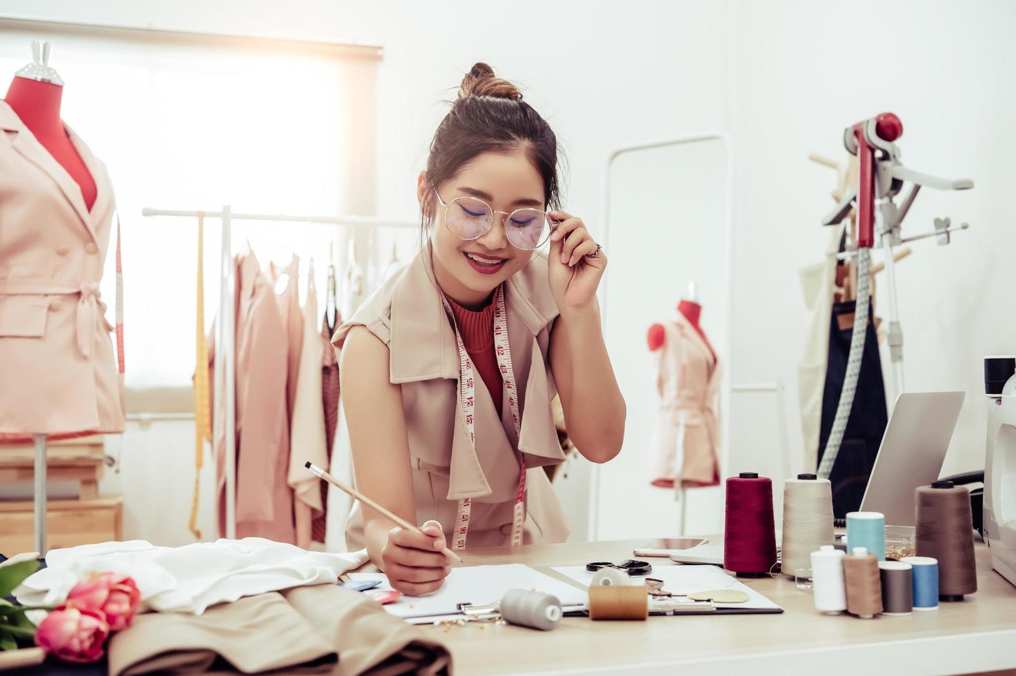 Female fashion designer working in office photo