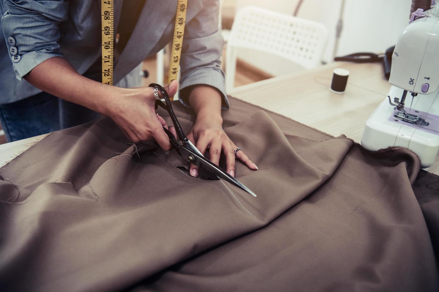 Dressmaker cutting fabric  photo