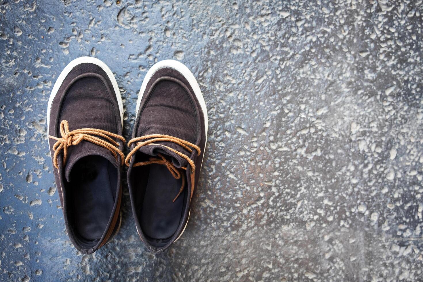 Pair of shoes on cement background photo