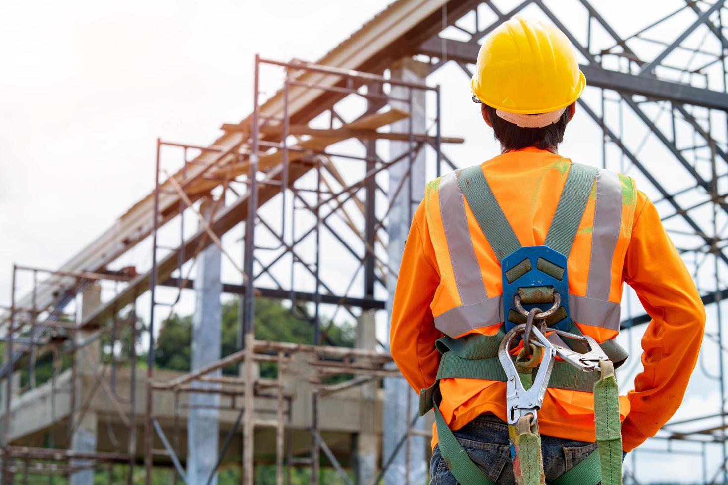 Construction worker in front of work site photo