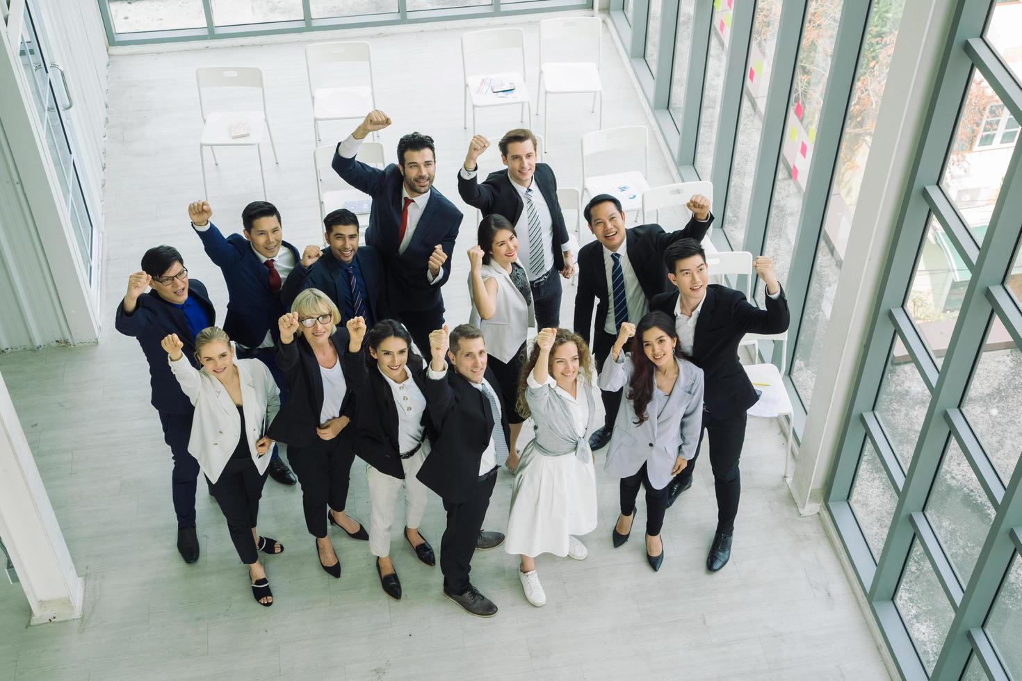 Multiethnic group of business professionals with fists up photo