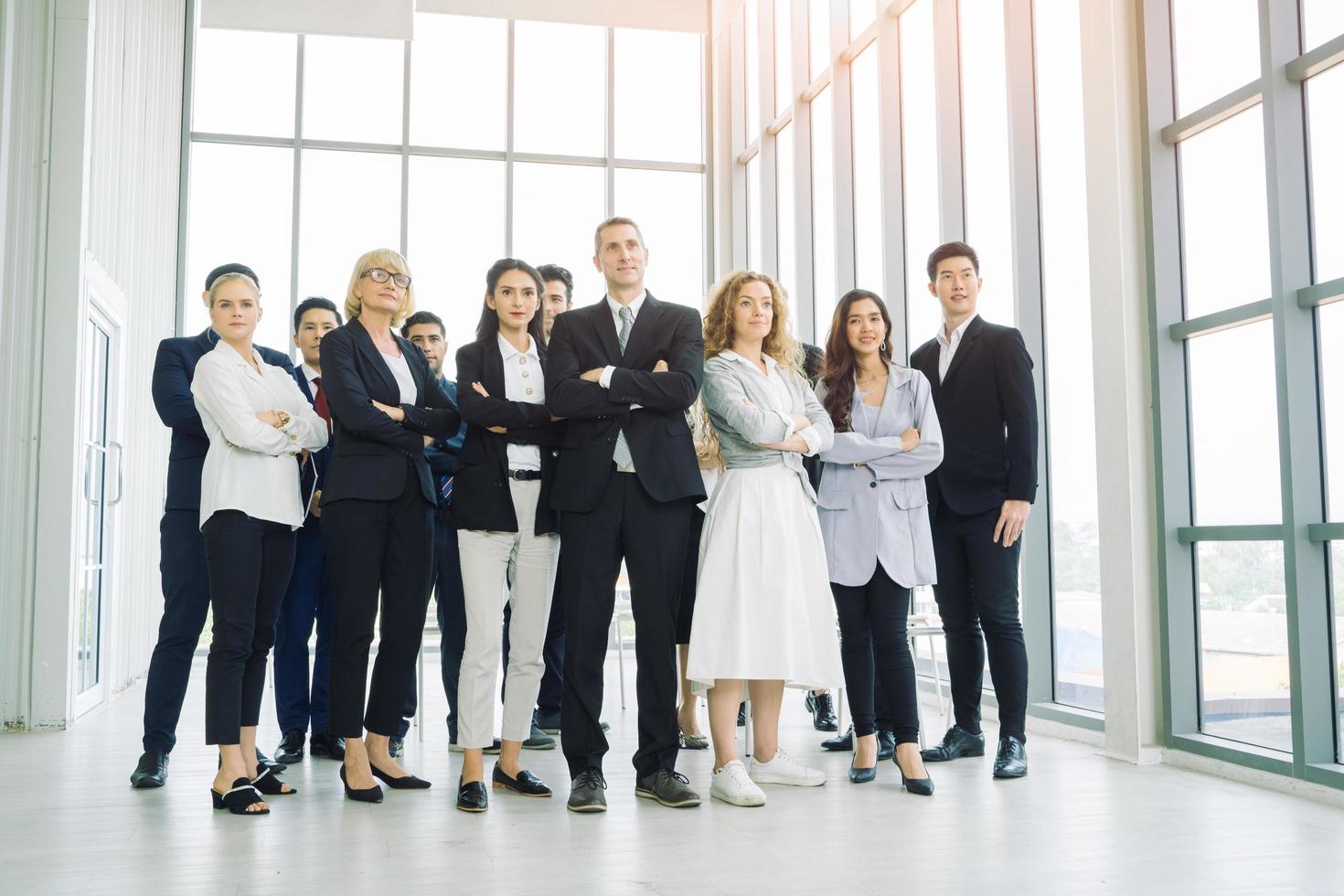 A group of professionals posing with crossed arms photo