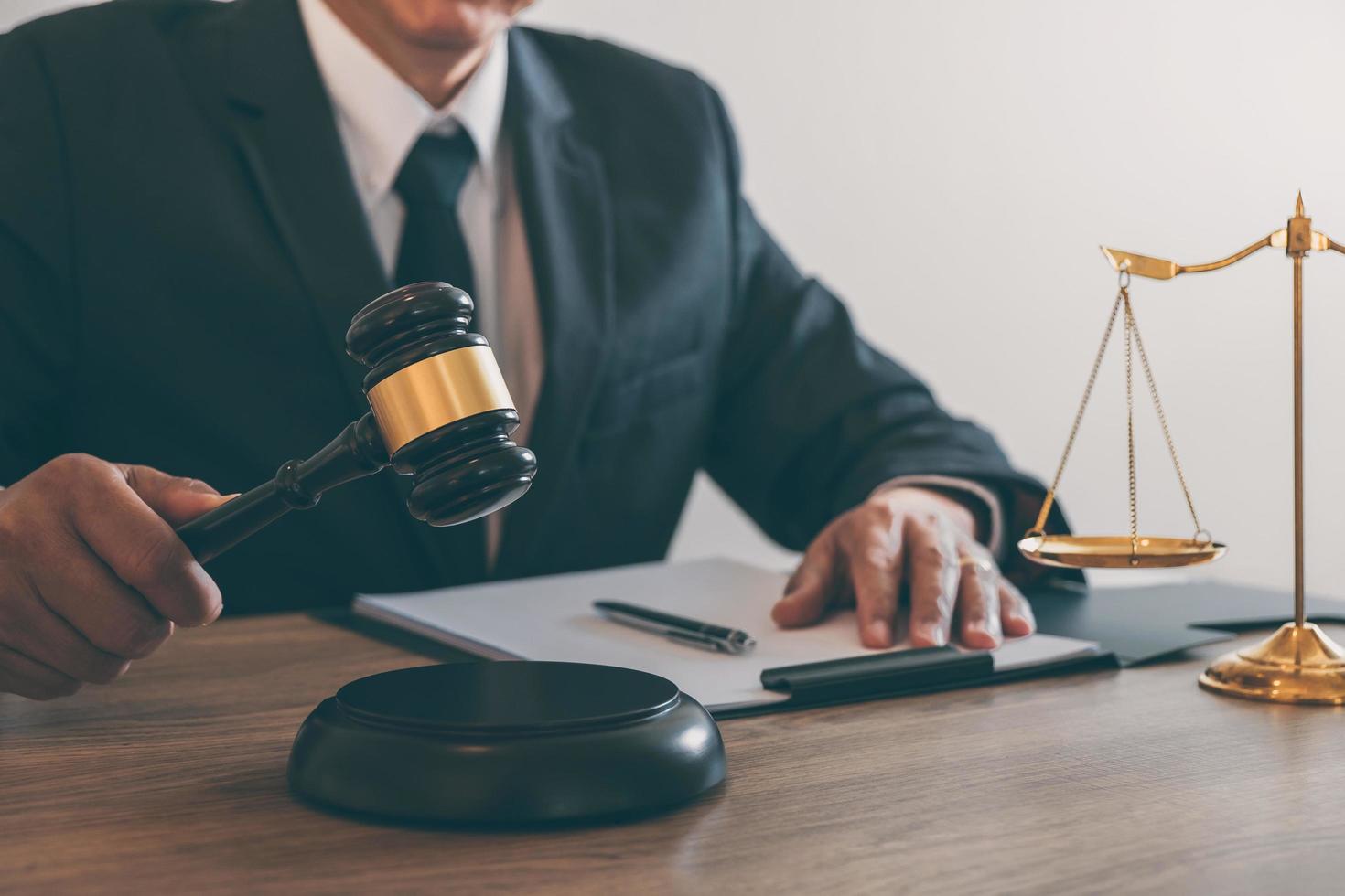 A judge is banging a gavel photo