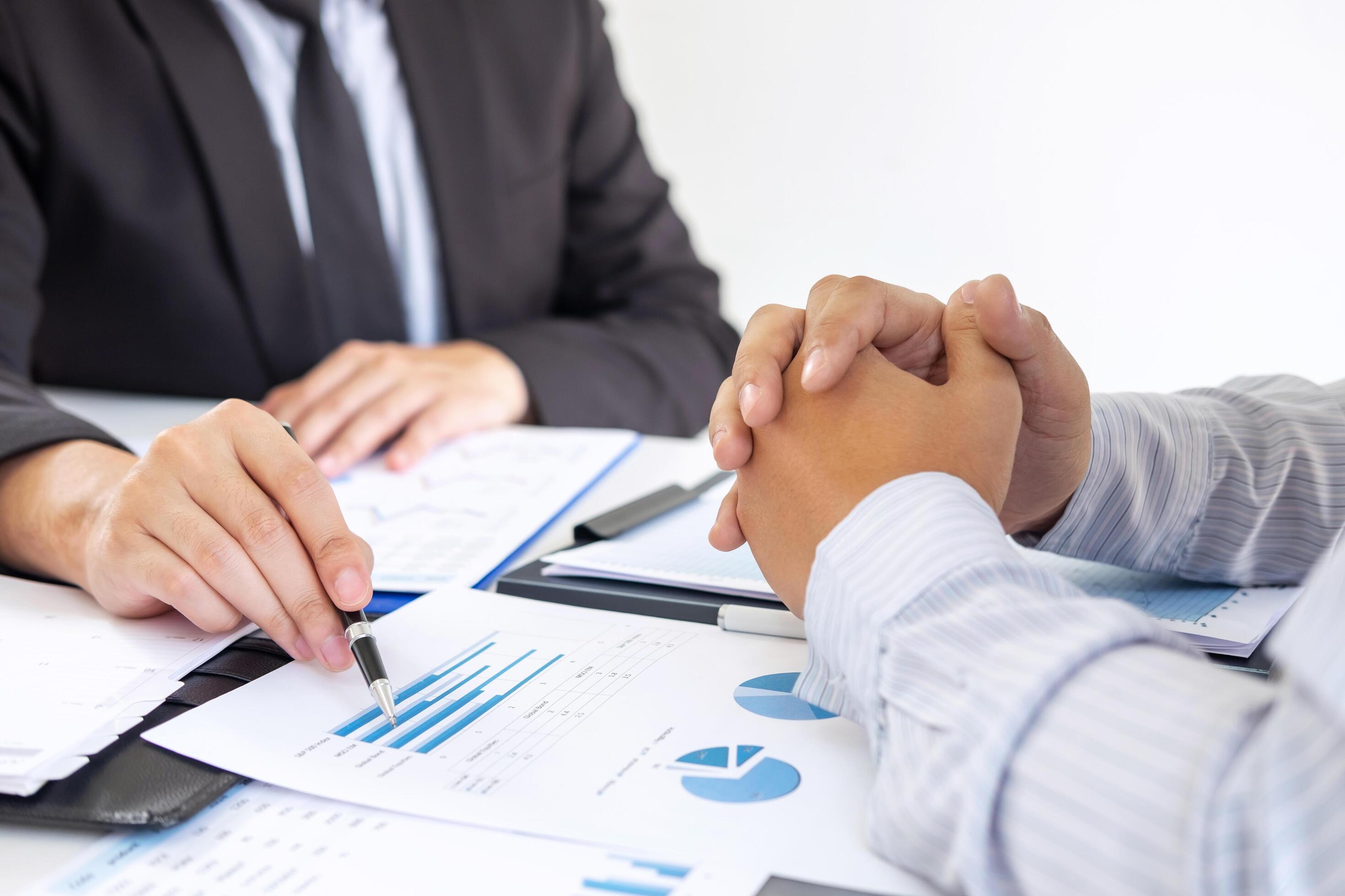 Two people discuss business plan 1226848 Stock Photo at Vecteezy