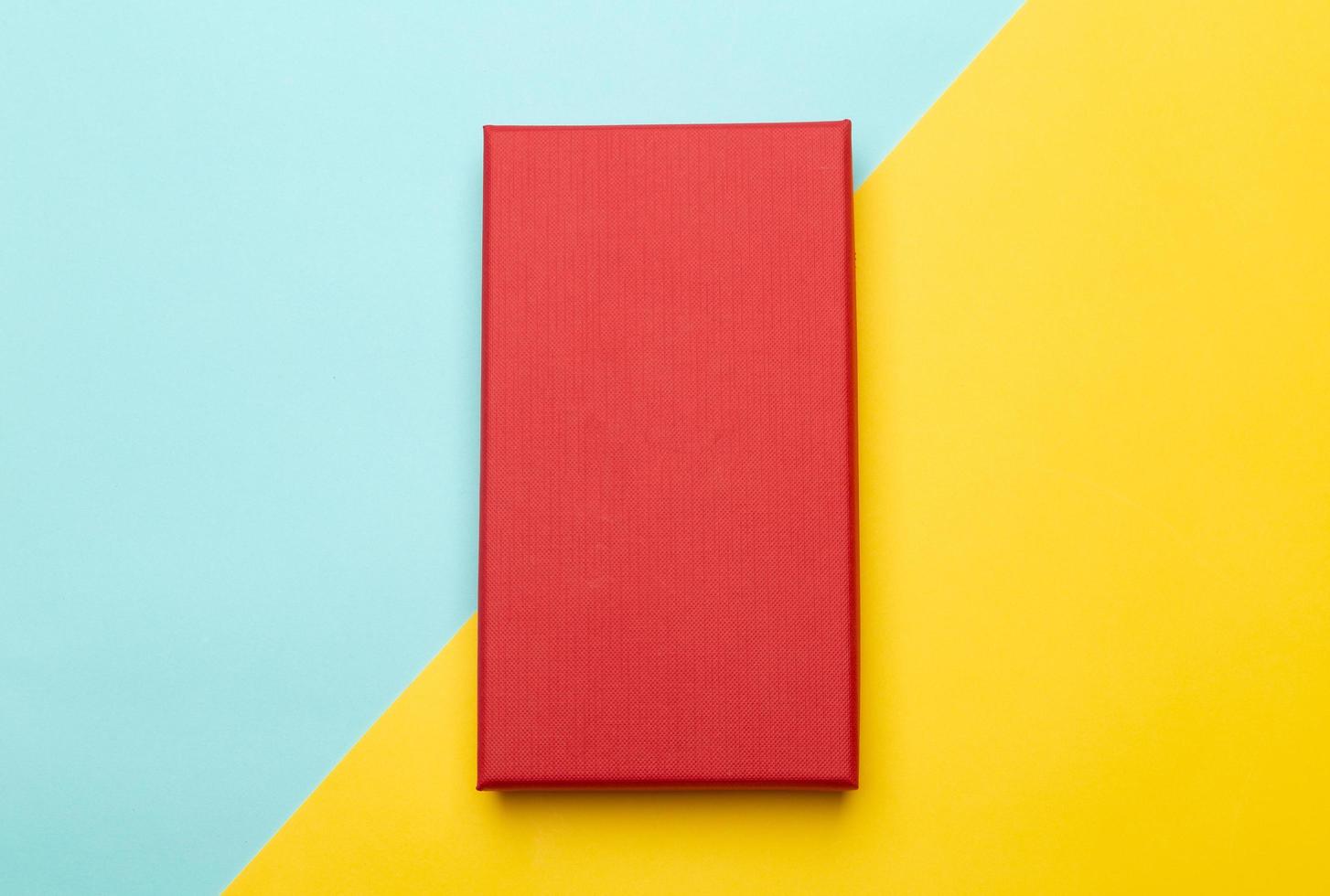 Red box on yellow and blue background photo