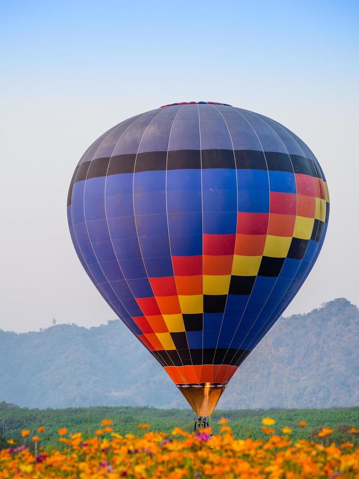 Colorful hot air balloon landing photo