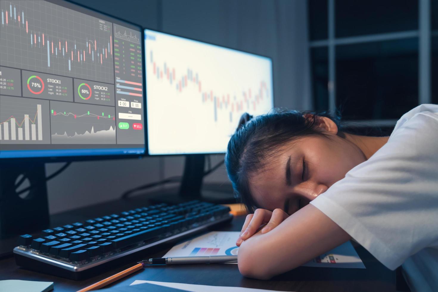 Woman falling asleep at computer photo