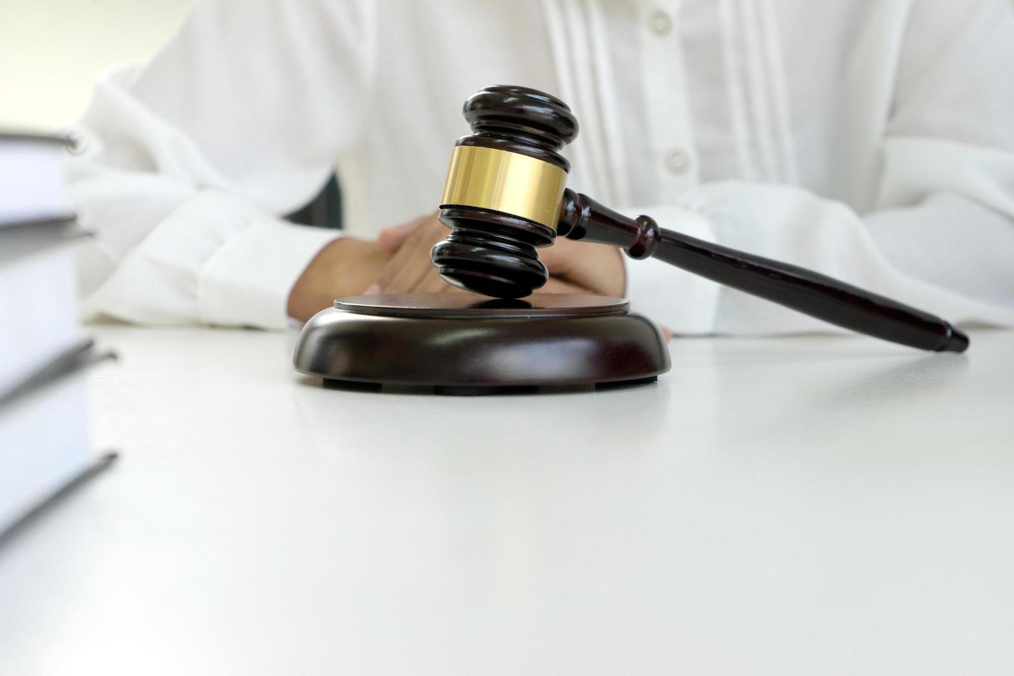 A gavel in front of judge at desk photo