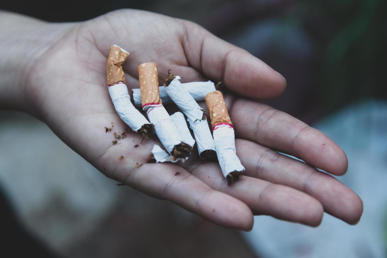 Hands breaking cigarettes  photo