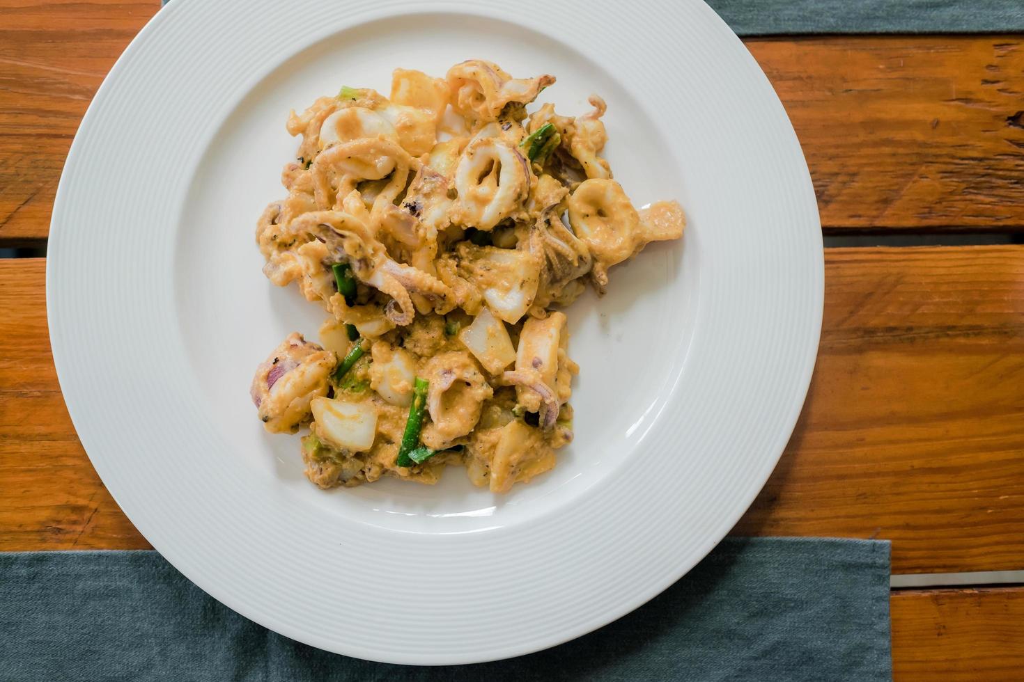 Stir-fried squid with salted eggs photo