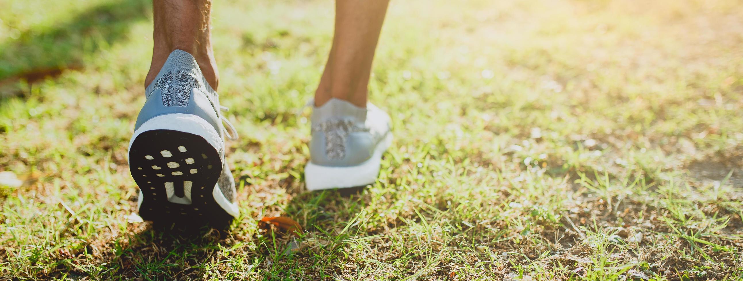 Cropped view of running feet outside photo