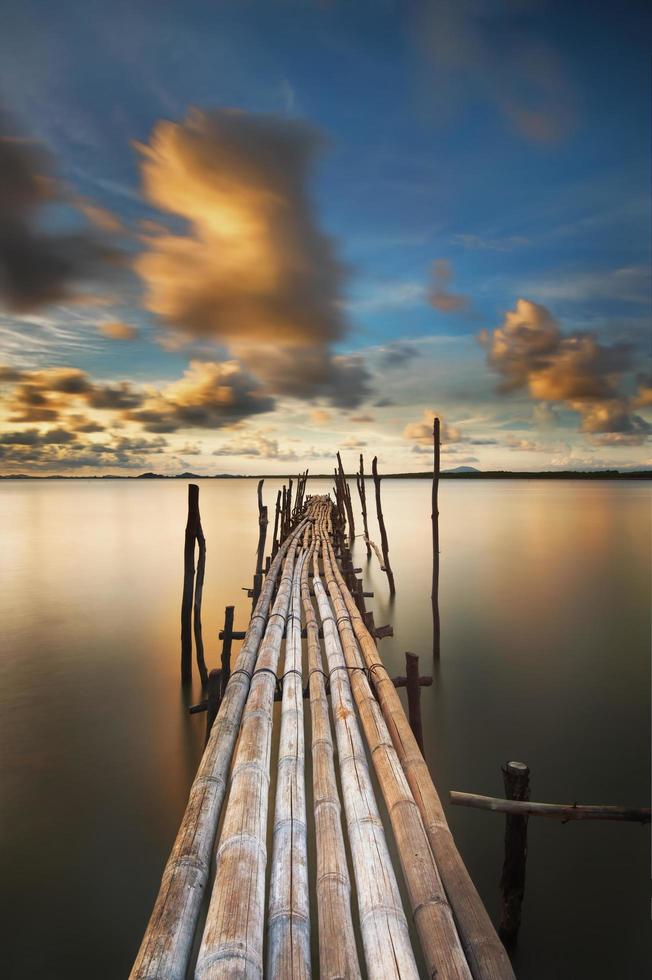 Bamboo bridge at sunset photo