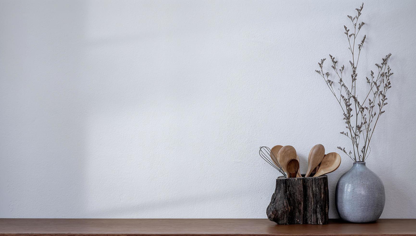 Wooden spoon and ceramic vase with space  photo