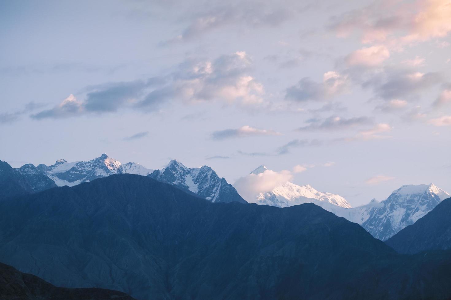 Sunrise over snow capped Karakoram mountain range photo