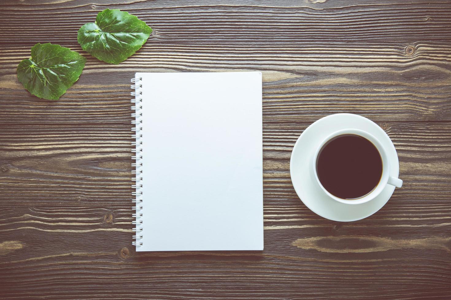 Empty notebook with cup of coffee photo