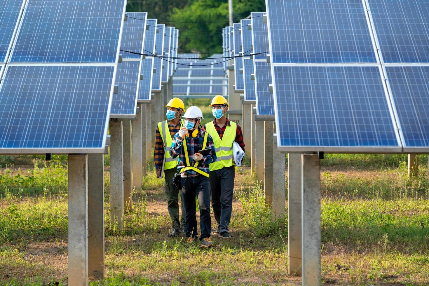 Man wearing safety equipment with solar panels photo