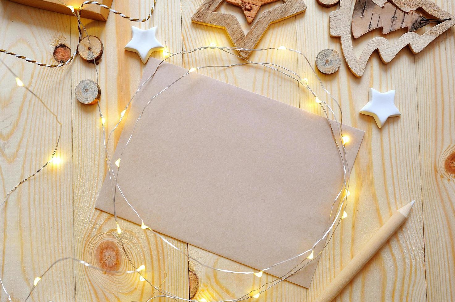 Blank paper among Christmas lights and decorations photo