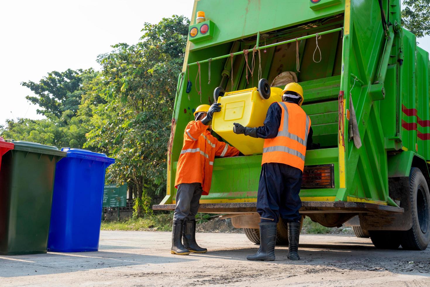 Garbage collectors with truck photo