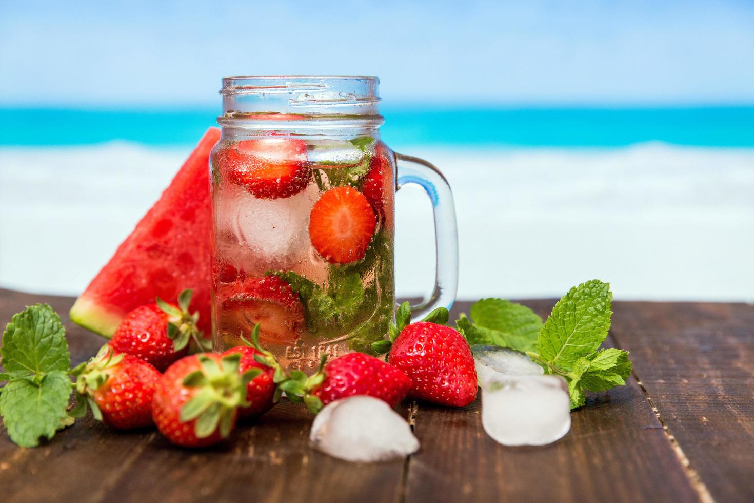 Strawberry drink against tropical background photo