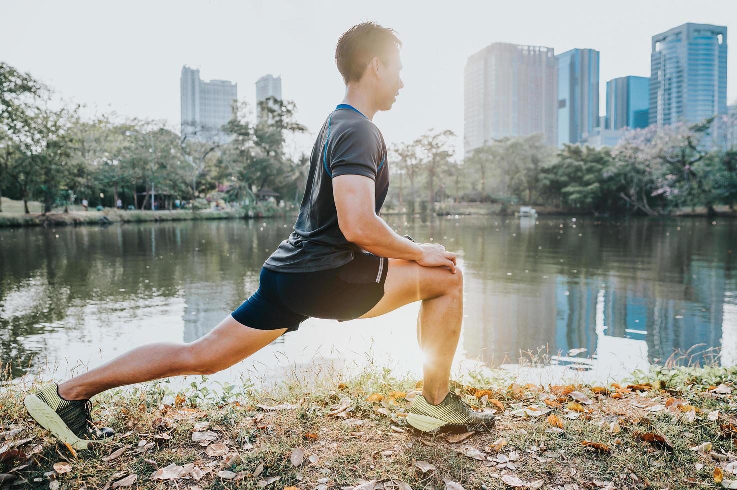 Runner doing stretching exercise photo