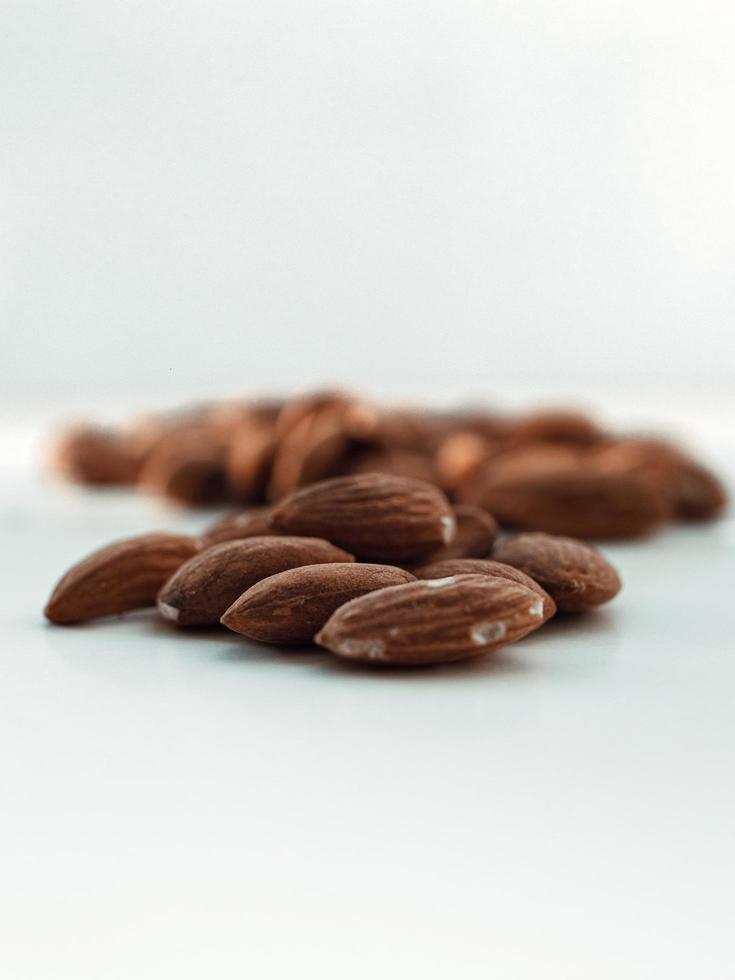 Almonds on white surface photo