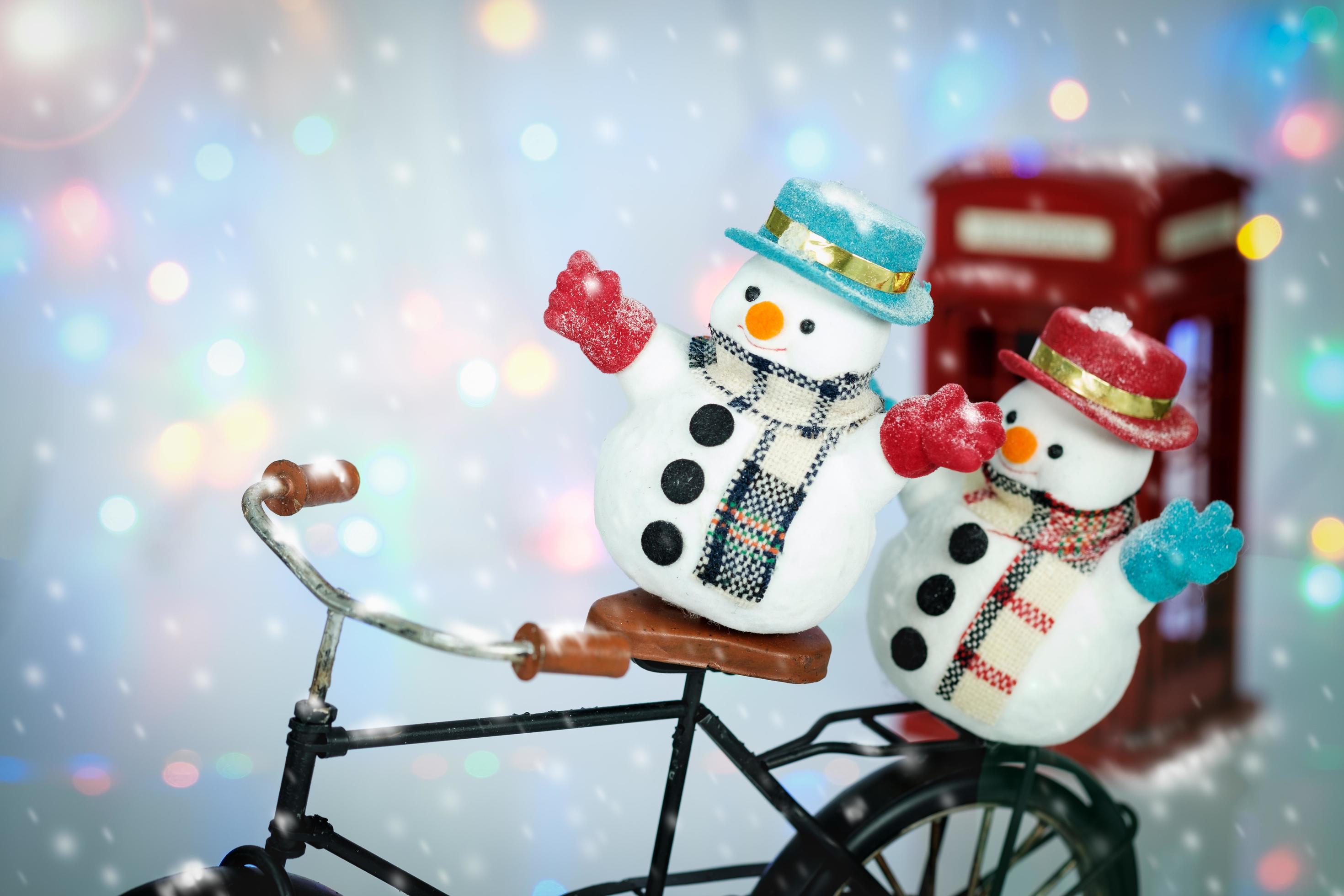 Snowmen on bicycle 1229941 Stock Photo at Vecteezy