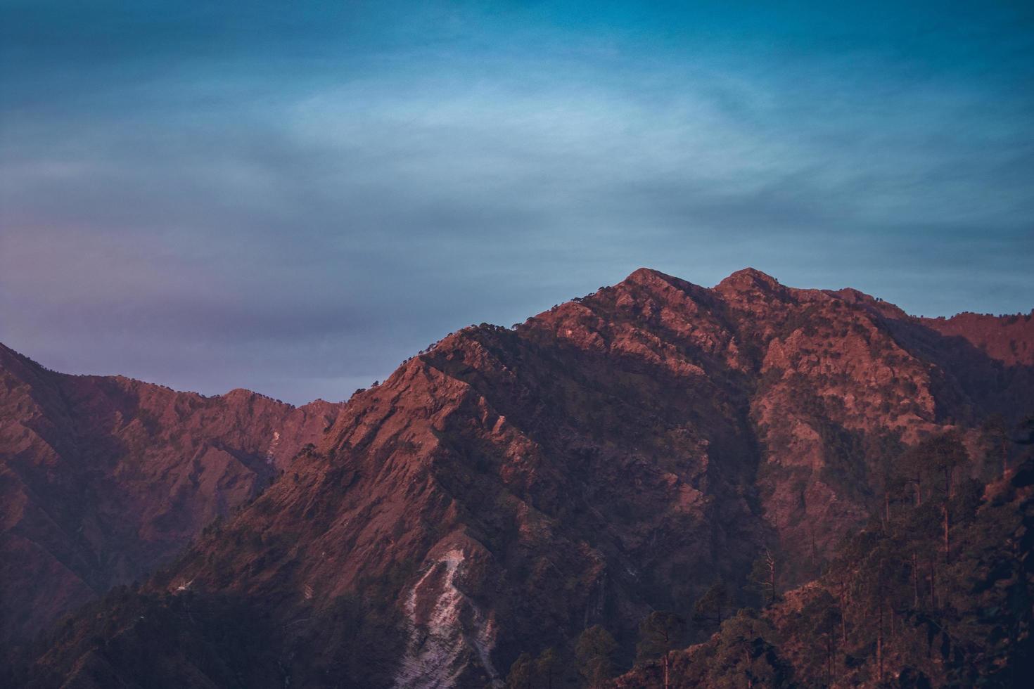 Mountain under blue sky photo