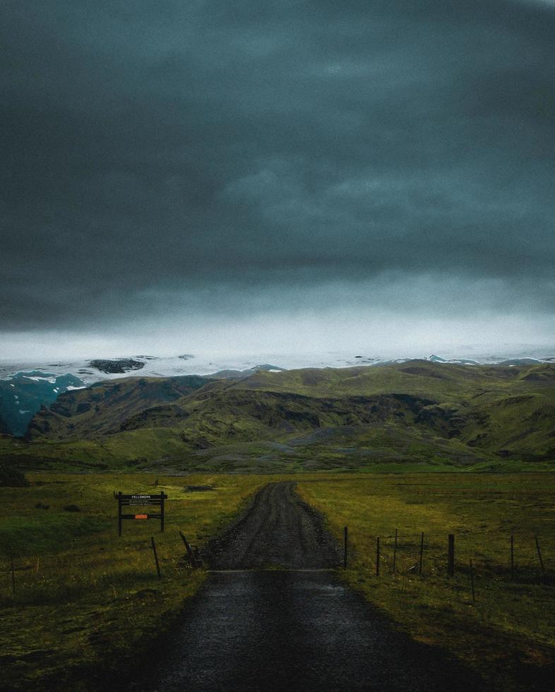 Mountain road leading to mountains photo