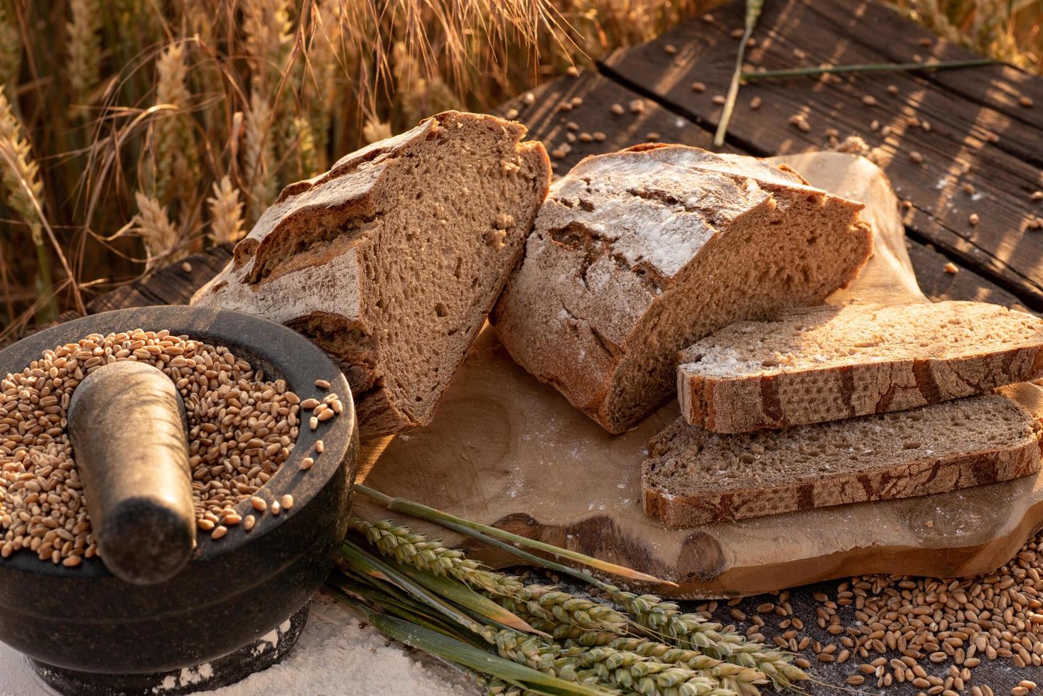 Sliced bread on wooden table photo